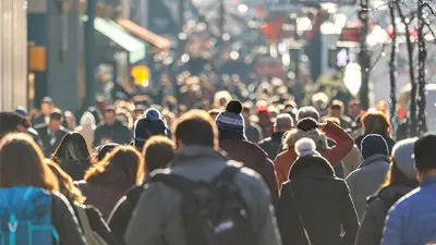 Crowded city street with dense foot traffic where pickpockets operate